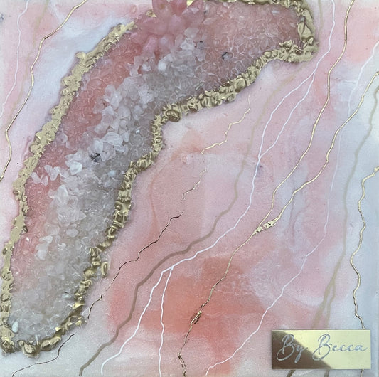 Handmade pink geode-inspired resin painting featuring quartz-like crystals, gold metallic accents, and flowing blush tones with a high-gloss resin finish.
